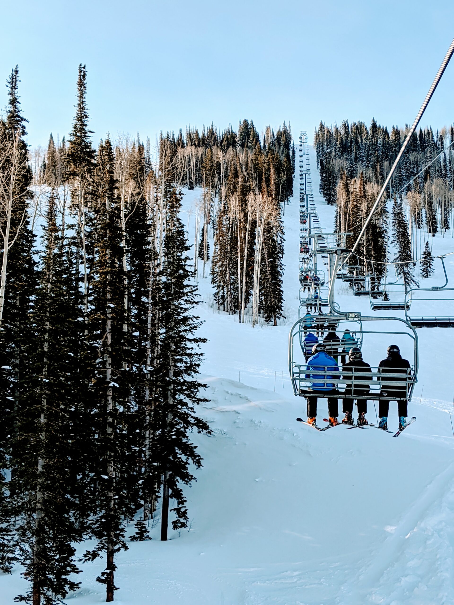 ski lift at Park City Mountain with trees on either side