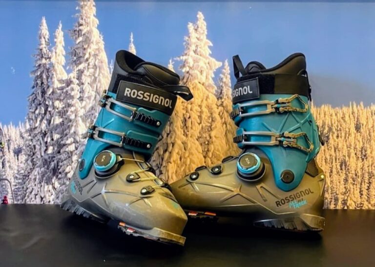 Rossignal BOA Ski boots tested with rental skiers on a bench with a snowy tree background