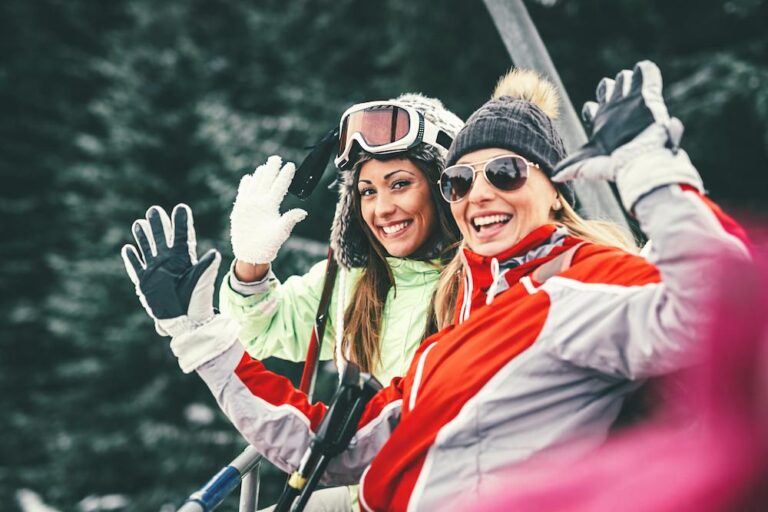Girls on ski lift happy to test out the best time to ski in Park City