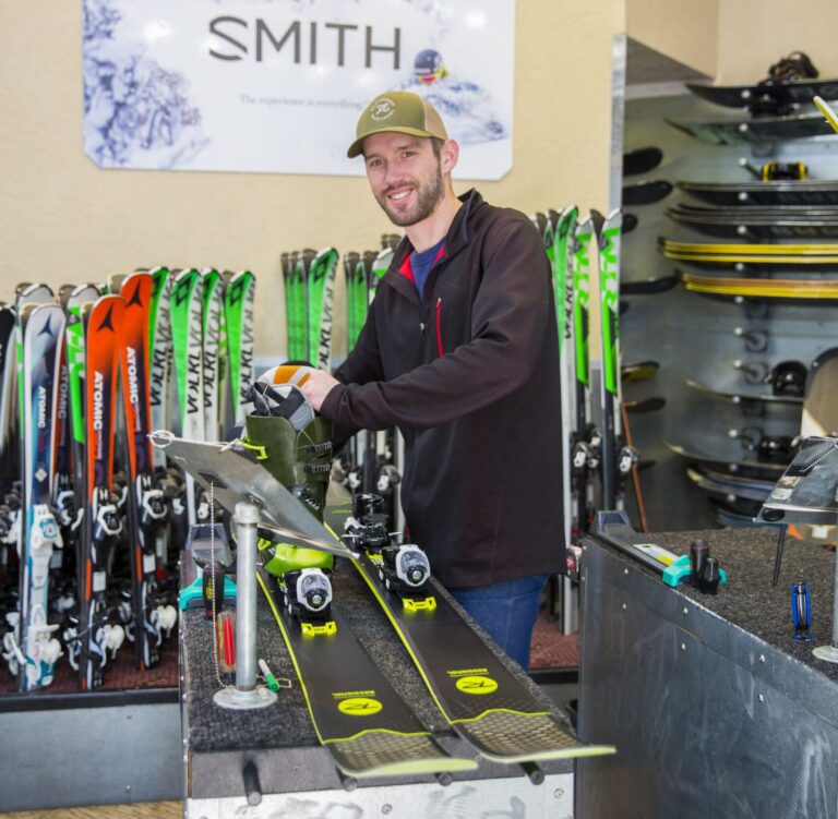 ski rental set up with smiling ski tech at Park City Sport